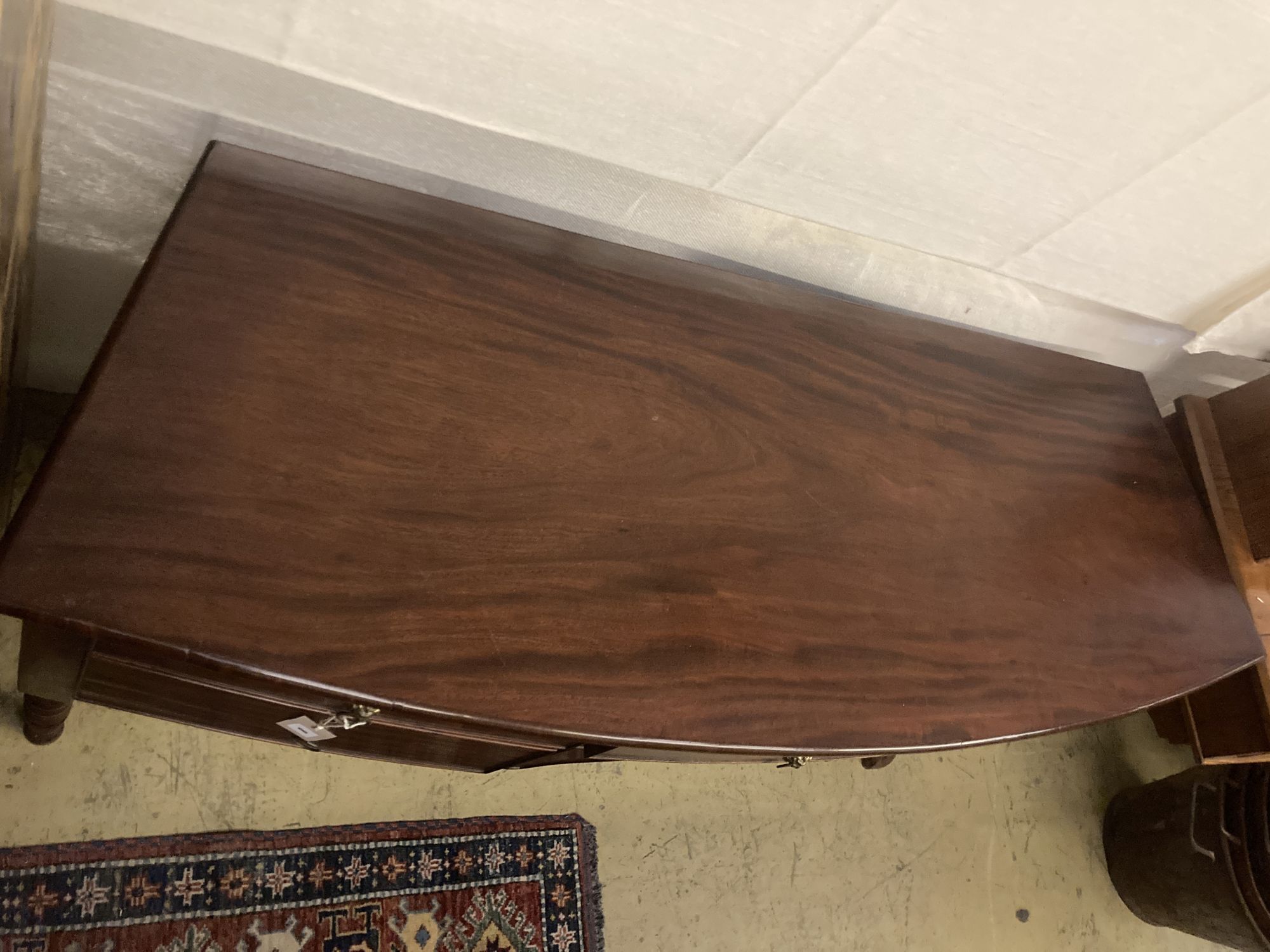 A Regency mahogany bowfront sideboard, width 145cm depth 51cm height 82cm